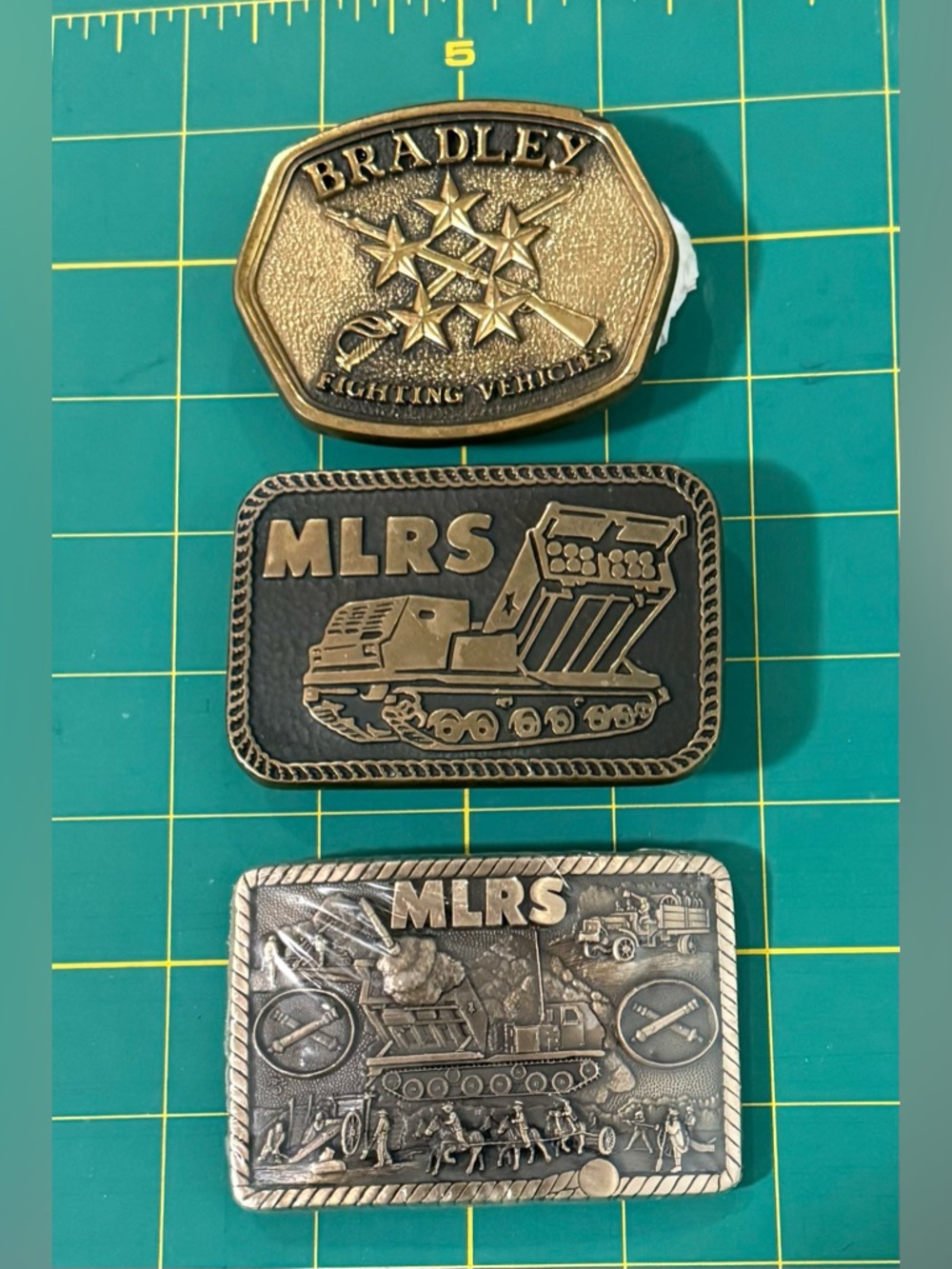 Vtg MLRS Multiple Launch Rocket System & Bradley Fighting Vehicle Brass Buckles